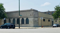 A photo of the Bosnian Islamic Cultural Center (BICC) brick building in Chicago located at 7022 N. Western Ave, Chicago, IL 60645, without any signage to not attract any non-Bosnian Muslims. The building is located across the street from the other Islamic center, Rahmat-e-Alam Foundation, with regular prayer services that serves other Muslim community in that area. BICC is commonly known among the Bosnian Muslims of Chicago as the Western Mosque.
