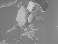 In black and white cinematography, a close-up of a graphic shows a man's hand stabbing the Phillipine Islands on the map at the beginning of the film. There is calligraphy on the knife, reading katakana カオ at the end of the shaft. The hand is wearing a ring with the Japanese Imperial Flag.