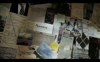 Collage of pictures, postcards, newspaper articles, and notes connected by strings attached to pushpins