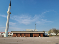 A view from the parking lot of the Bosnian Muslim-run Islamic Community Center at 4666 Lansdowne Ave, St. Louis, MO with a 107-foot-high minaret next to it, dominating the building and surrounding parking lot. In a Muslim place of worship, a masjid with a tall minaret is another visual representation of “back home.” In 2007, Bosnian Muslims led the initiative to buy a bank building in a strip mall close to the Bevo Mill neighborhood and convert it into their own masjid. To give it religious significance and make it look more like a ‘back home’ masjid they added a minaret next its southwest corner. During my fieldwork, I was told that they built it taller than initially planned, but city officials were accommodating and adjusted the permit to allow it. This masjid was the first Bosnian Muslim place of worship in the city and it served an important purpose as an initial religious and community center. Although minarets are used for the call to prayer, this one stands only for decoration.