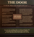 This photograph presents a sign that appears in “The Door” exhibit at Ark Encounter. Text that appears horizontally at the top and bottom of the sign associate the Ark’s door with Jesus as the one “door” to eternal life. The middle of the sign consists of two columns of text, a combination of assertions about Noah’s experience and biblical scripture supporting those claims. In the center of the sign, a box contains the words “Jesus Is Our One Door To Salvation,” with the words “one door” presented in bold font.