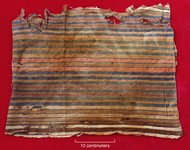 A photo of a warp-stripe plain weave cotton textile with multicolored stripes.