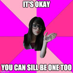 A white woman with long dark hair and thick glasses smirks at the camera and shows off the word “NERD” written on the palm of her hand. She has been photoshopped onto a pinwheel background with varying shades of pink. Top text reads, “It’s okay.” Bottom text reads, “You can still be one too.”