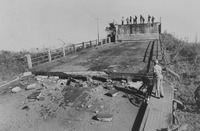Fig. 40. A photographic print of unidentified people surveying a destroyed bridge after an attack on Mozambique by Rhodesia’s military.