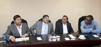 Photograph of the Guptas, Ajay and Atul, Jagdish Parekh and President Zuma’s son, Duduzane seated at a table.
