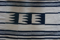 Detail of handwoven blanket, made with handspun natural and indigo-dyed cotton thread.