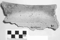 Fig. 15. Interior of rim sherd whose upper half is black with soot while the lower half is clean.