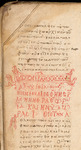 A tan parchment with Greek lettering in red and black. Ornamentation is in the middle.