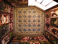 Source: Photo by author with permission of La Soprintendenza per i beni storici e artistici delle Marche View of ceiling and gallery of 28 illustrious men, Urbino studiolo.