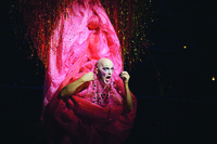 Performer Taylor Mac in a costume representing a giant pink vulva during a performance of A 24-­Decade History of Popular Music in San Francisco, California.
