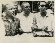 Dr. Martin Luther King Jr. (left) marching with CORE’s Floyd B. McKissick and an unidentified man in July 1966.