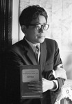 A photograph of Ōe Kenzaburō circa 1964, when he was writing A Personal Matter, holding a copy of Stanford’s General Map of Africa. Note Ōe’s skewed gaze: Ōe asks readers to make eye contact with the cartography of Africa rather than the Japanese author who holds the map. Republished with permission from Shinchōsha.