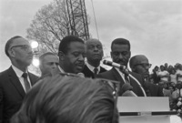 Ralph Abernathy leads the funeral service for Martin Luther King Jr. at South View Cemetery. Also participating are Benjamin Mays (left) and Fred Shuttlesworth, April 9, 1968.