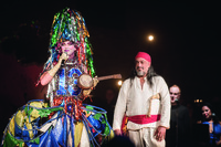 Performer Taylor Mac in drag with performer Timothy White Eagle in traditional Native American dress during a performance of A 24-­Decade History of Popular Music in Brooklyn, New York.