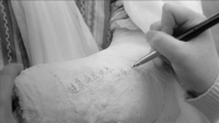 Calligraphy being written on a cast.