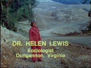 Color video of Lewis standing in front of massive strip mine, talking about destruction of mountain behind her.