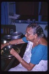 A Bengali woman eats her lunch.