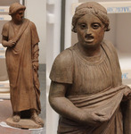 Fig. 1. Terracotta statues of comic actors, each about 115 cm tall, wearing soleae, full-body tights, tunics, masks, and wigs; Pompeii, late first century BCE.
