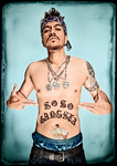 Color photographic portrait of a young Samoan man dressed comically as a youth gang member, with a bandana, shiny necklaces, and tattoos.