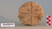 Fig 74a: Inscribed Material from Bīr Shawīsh 12 is jar lid with XOEX inscribed on it. The lid has a dimension of 5.7 cm height (74b) and maximum diameter 6.5 cm (74a). The disc perimeter has a wavy design.