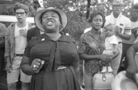 Fannie Lou Hamer singing to a group of people in Mississippi during the James Meredith-inspired “March Against Fear,” June 1966.