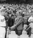 Fig. 16. A photo of President Nixon throwing out the first pitch of a baseball game, 1969.