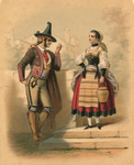 A Portuguese man and woman chat on a street corner, each dressed in their colorful traditional dress. He wears a tall black conical hat, short jacket, short breeches, and tall embroidered boots. She wears a red skirt, a striped yellow apron, and a black bodice.