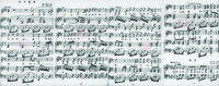 Four sheets of music spreading from right to left and with lyrics in Chinese.
