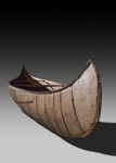 A color photograph of a birch-bark canoe.