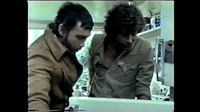 Bodie and Doyle peering into an open refrigerator