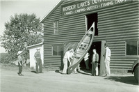 Sigurd Olson’s Border Lakes Outfitting Company supplied paddlers with the necessary gear during the 1940s. Here a canoe is retrieved from the company warehouse, April 4, 1940.