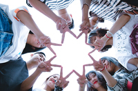 Fig. 34. A photograph of a group of people forming a star with their fingers.