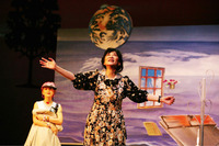 Nightingale (Chang Hsiao-yen), center, telling the story of her husband's having traveled to a distant star called Penefere, while her daughter, Stranger (Aya Liu), left, looks on.
