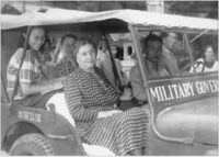 Helen Keller in military vehicle, Japan, 1948.