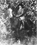 Helen Keller horseback riding in California during the filming of Deliverance, 1919.