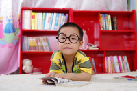 Fig. 29. A photograph of a young child near a bookshelf.